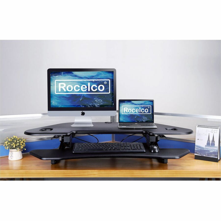 Image of Rocelco Desk Riser,Corner,4 AC Outlets,Grommet,45-1/2"x23-1/4",BK